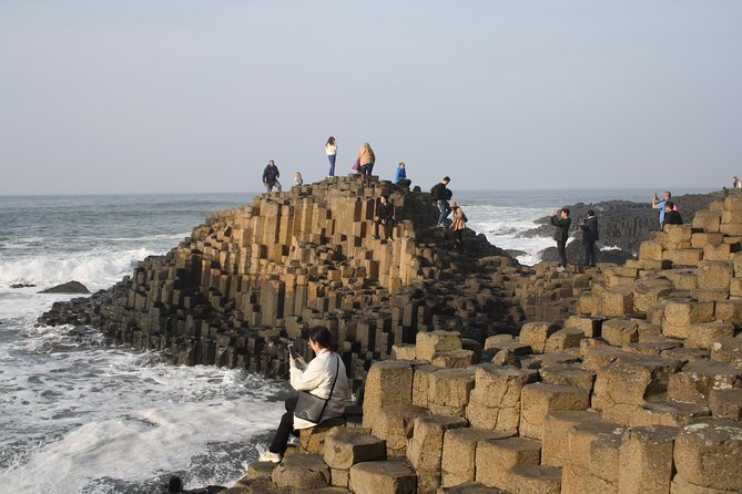 Giant's Causeway Day Tour and Belfast City Tour 1 Day Pass - Cushendun Caves require steady footing