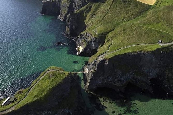 Private Luxury Mercedes Rope Bridge Giants Causeway Coastal Tour - Dunluce Castle and the coast near Bushmills